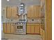 Well-equipped kitchen with stainless steel appliances and wooden cabinets at 112 Windalier Rdg, Peachtree City, GA 30269