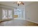 Cozy living area featuring updated flooring, recessed lighting, and a view of the kitchen space at 112 Windalier Rdg, Peachtree City, GA 30269