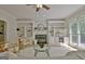 Cozy living room featuring a fireplace, built-in shelves, and views to the deck at 112 Windalier Rdg, Peachtree City, GA 30269