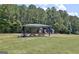 Community picnic area features a shaded picnic table and a playground nearby for children at 112 Windalier Rdg, Peachtree City, GA 30269