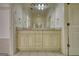Bathroom featuring double sinks, a large mirror, cabinets, and white tiled floors at 1880 Hickory Station Cir, Snellville, GA 30078