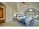 This staged bedroom includes a bed, side tables, and a window, creating a cozy atmosphere at 1880 Hickory Station Cir, Snellville, GA 30078