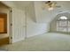 The bedroom features neutral carpet, an open door, and a window, providing comfort and natural light at 1880 Hickory Station Cir, Snellville, GA 30078