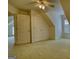The bedroom features neutral carpeting, two closets, and a window for a cozy space at 1880 Hickory Station Cir, Snellville, GA 30078