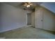 This room features a neutral carpet, ceiling fan, and closet, offering comfort and practical storage at 1880 Hickory Station Cir, Snellville, GA 30078