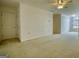 Bonus room with neutral carpet, a door, and a window, creating a comfortable living space at 1880 Hickory Station Cir, Snellville, GA 30078