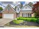 Charming brick home with manicured landscaping and a two-car garage at 1880 Hickory Station Cir, Snellville, GA 30078