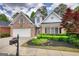 Beautiful brick home with landscaped front yard, healthy shrubs and attractive mailbox at 1880 Hickory Station Cir, Snellville, GA 30078