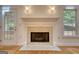 Classic living room fireplace with tile surround and glass door with access to the patio at 1880 Hickory Station Cir, Snellville, GA 30078