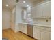 Spacious kitchen with white cabinets, stainless steel appliances, and hardwood floors at 1880 Hickory Station Cir, Snellville, GA 30078