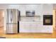 Kitchen featuring stainless steel appliances, white cabinets, and hardwood floors at 1880 Hickory Station Cir, Snellville, GA 30078