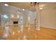 Light-filled living room boasts hardwood floors, fireplace and soaring ceilings at 1880 Hickory Station Cir, Snellville, GA 30078