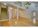 Spacious open-concept living area with hardwood floors and tall ceilings at 1880 Hickory Station Cir, Snellville, GA 30078