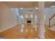 Bright living room with a fireplace, tall ceilings, and gleaming hardwood floors at 1880 Hickory Station Cir, Snellville, GA 30078