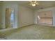 Spacious living room with carpeted floors and access to the upstairs loft area at 1880 Hickory Station Cir, Snellville, GA 30078