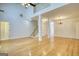 Large living room features gleaming hardwood floors, two-story ceiling and bright lighting at 1880 Hickory Station Cir, Snellville, GA 30078