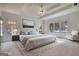 Spacious main bedroom features a sitting area, plush carpet, and natural light at 1880 Hickory Station Cir, Snellville, GA 30078