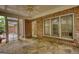Covered stone patio featuring brick walls, a ceiling fan, and outdoor access at 1880 Hickory Station Cir, Snellville, GA 30078