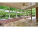 Screened patio offering a view of the landscaped backyard and greenery at 1880 Hickory Station Cir, Snellville, GA 30078