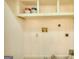 Close-up of a wall with electrical outlets and open shelving at 1880 Hickory Station Cir, Snellville, GA 30078