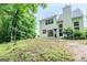 Large backyard with a patio, surrounded by lush greenery at 2022 Maple Ridge, Acworth, GA 30101