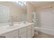 Full bathroom with tub/shower combo, double sinks, and ample lighting at 2022 Maple Ridge, Acworth, GA 30101