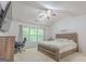 Comfortable bedroom with a bed, work space and lots of natural light at 2022 Maple Ridge, Acworth, GA 30101