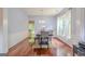 Elegant dining room featuring hardwood floors, large windows, and tasteful decor and furniture at 2022 Maple Ridge, Acworth, GA 30101
