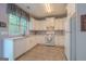 Charming kitchen featuring white cabinets, tile floors, and lots of natural light at 2022 Maple Ridge, Acworth, GA 30101