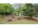 Community picnic area with picnic tables, benches, and a playground offering space for outdoor fun at 2022 Maple Ridge, Acworth, GA 30101