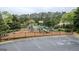 Fenced-in playground with slides and a picnic table offers a safe and fun play area at 2022 Maple Ridge, Acworth, GA 30101