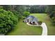 Aerial view of the home showing the manicured lawn and circular driveway at 391 Massengale Rd, Brooks, GA 30205