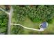 Aerial view of home on wooded lot, with winding driveway at 391 Massengale Rd, Brooks, GA 30205