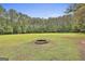 Expansive backyard features a fire pit and plenty of open space at 391 Massengale Rd, Brooks, GA 30205