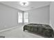 Clean bedroom with neutral walls and flooring, large window for ample natural light, and cozy atmosphere at 391 Massengale Rd, Brooks, GA 30205