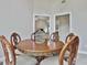 Cozy dining room featuring a round table with ornate chairs and a decorative centerpiece at 391 Massengale Rd, Brooks, GA 30205