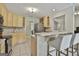Kitchen featuring breakfast bar, wood cabinets and stainless steel refrigerator at 391 Massengale Rd, Brooks, GA 30205