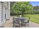 Patio with a round table and chairs with an expansive backyard view at 391 Massengale Rd, Brooks, GA 30205