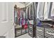 Organized walk-in closet with shelving, hanging rods, and storage boxes for optimal space utilization at 391 Massengale Rd, Brooks, GA 30205