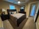 Cozy bedroom featuring carpet flooring, a ceiling fan, and a queen sized bed at 851 Walkingstick Dr, Douglasville, GA 30134