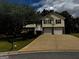 Charming two-story home with a two-car garage and a well-maintained lawn at 851 Walkingstick Dr, Douglasville, GA 30134