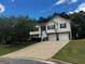 Charming two-story home with a two-car garage and a well-maintained lawn at 851 Walkingstick Dr, Douglasville, GA 30134