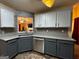 Stylish kitchen with gray cabinetry, stainless steel appliances, and a mosaic backsplash at 851 Walkingstick Dr, Douglasville, GA 30134