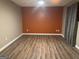 The living room features updated laminate flooring and an accent wall at 851 Walkingstick Dr, Douglasville, GA 30134