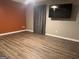 A modern living room features updated laminate flooring and a flat-screen television at 851 Walkingstick Dr, Douglasville, GA 30134