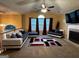 Cozy living room with vaulted ceiling, modern furniture, and a fireplace at 851 Walkingstick Dr, Douglasville, GA 30134