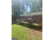 Brick home's backyard features a wood deck with a railing and lush green space at 288 Harper Se Rd, Atlanta, GA 30315