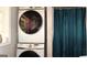 Bathroom with stacked washer and dryer unit at 288 Harper Se Rd, Atlanta, GA 30315
