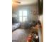 Bright bedroom featuring a bunk bed, large window, ceiling fan and carpeted floor at 288 Harper Se Rd, Atlanta, GA 30315