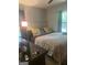 Bright bedroom featuring a ceiling fan, a large window and desk with a lamp at 288 Harper Se Rd, Atlanta, GA 30315